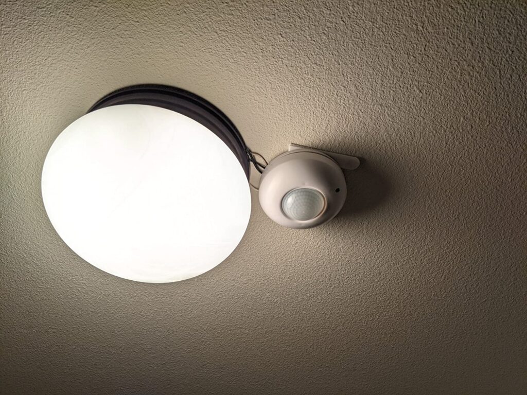 ceiling occupancy sensor installed next to the light