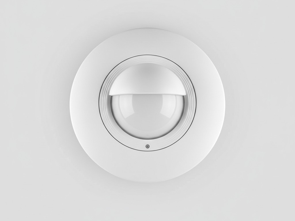 Sensor de Ocupação de Teto de Linha de Tensão Conectado Permanentemente Uma foto limpa e simples de um sensor de ocupação branco, redondo, conectado à fiação, projetado para ser instalado no teto, mostrado contra um fundo simples.